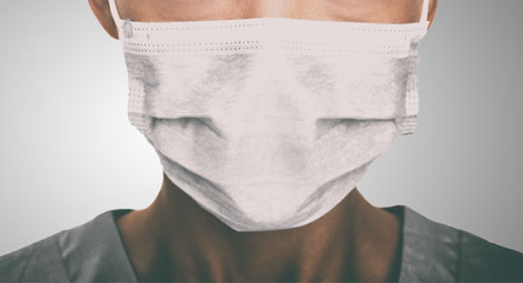 Clinician wearing a face mask